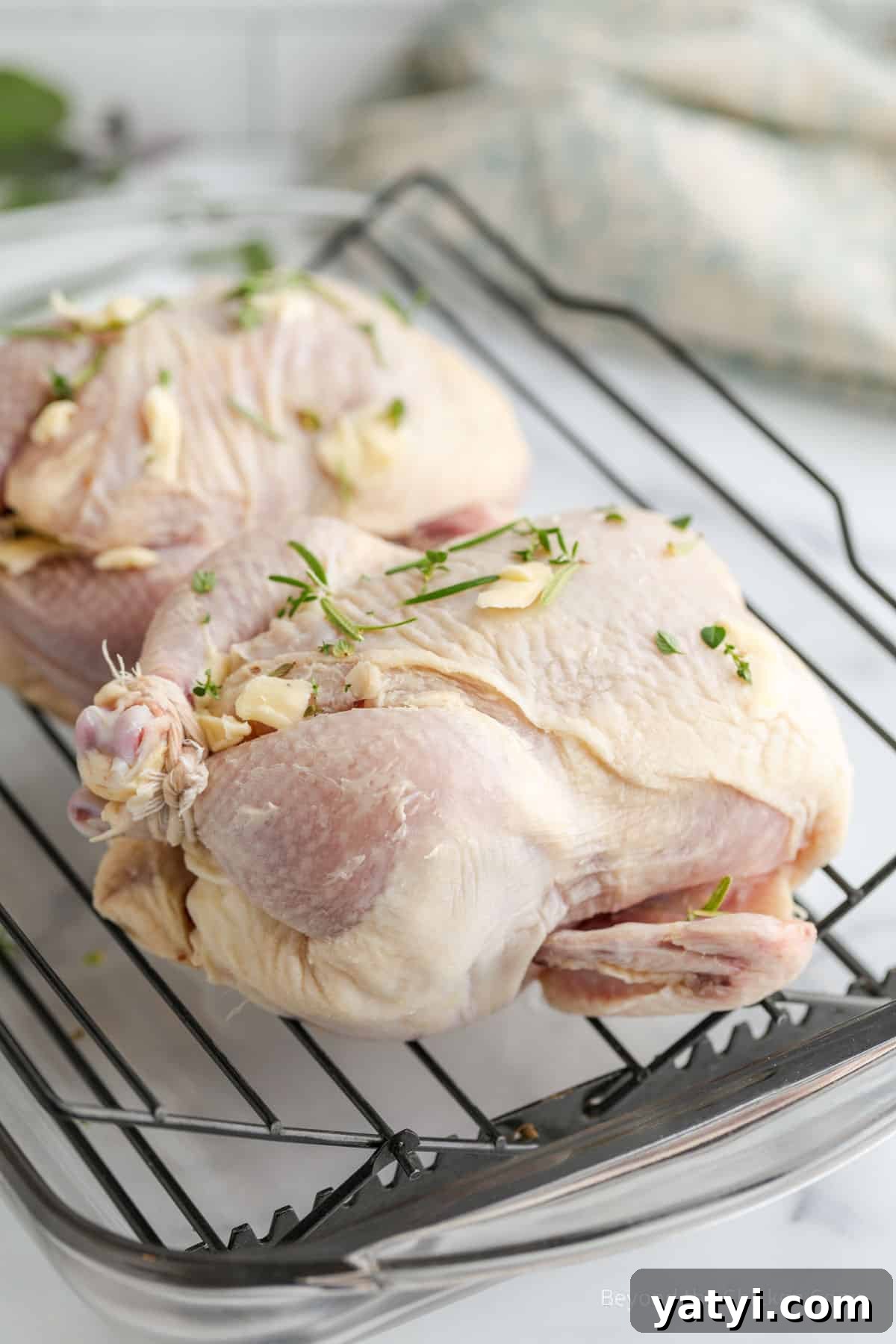 Herb-Roasted Stuffed Cornish Hens with Garlic and Lemon 6 Butter and herbs on uncooked hens.