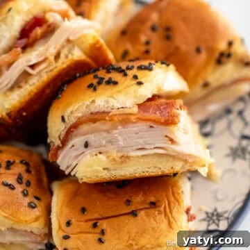 A pile of Turkey Bacon Sliders on a plate.