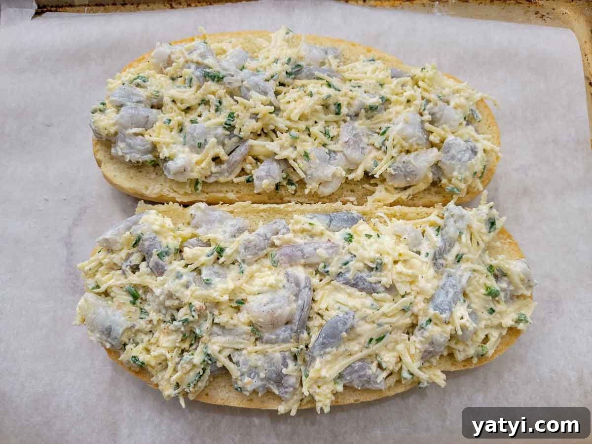 cheese and shrimp mixture spread on Italian loaf halves.