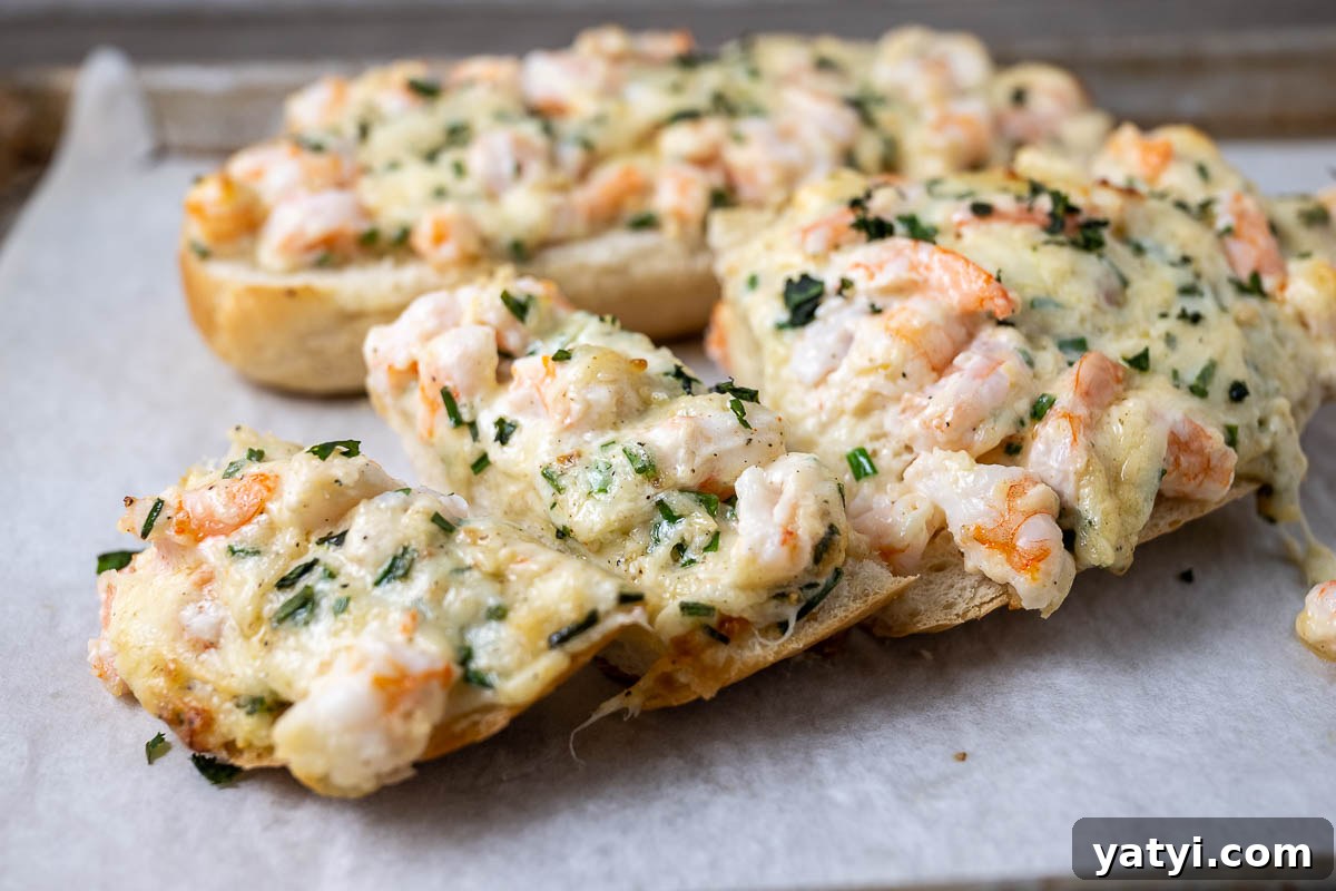 Cheesy Shrimp Garlic Bread on a baking sheet.
