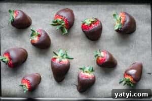 Decadent Chocolate-Covered Strawberries Recipe for Any Occasion 7 homemade chocolate covered strawberries on parchment