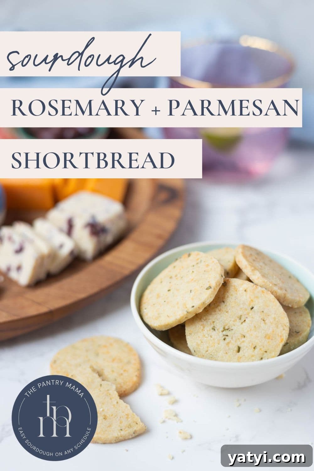 Rosemary Parmesan Shortbread Made with Sourdough Discard 9 Sourdough discard rosemary and parmesan shortbread in a bowl with a cheese board in background and text overlay on the image for a Pinterest Pin.