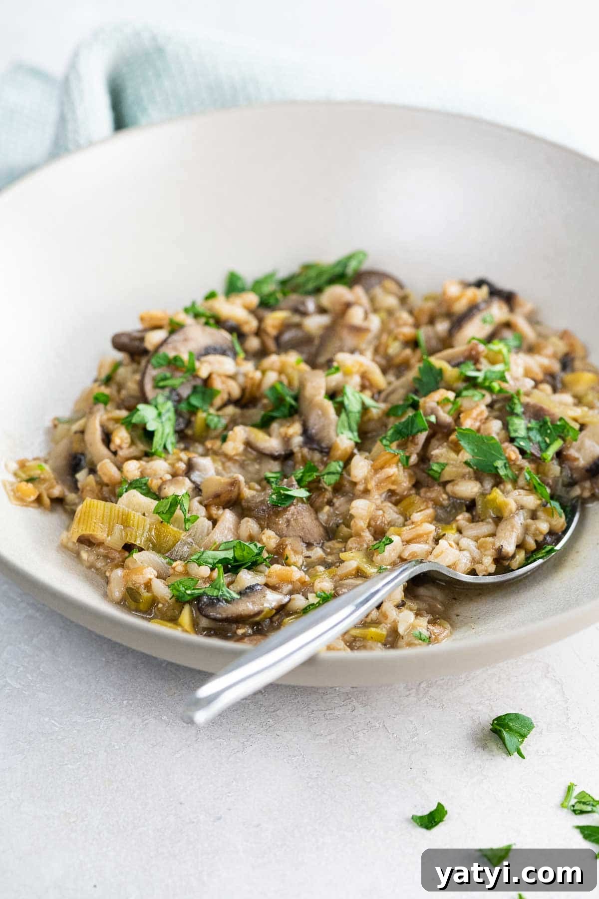 Vegan Thanksgiving Menu Ideas: Plant-Based Dishes to Impress 5 farro with mushrooms, leeks, and chestnuts in a bowl with a spoon