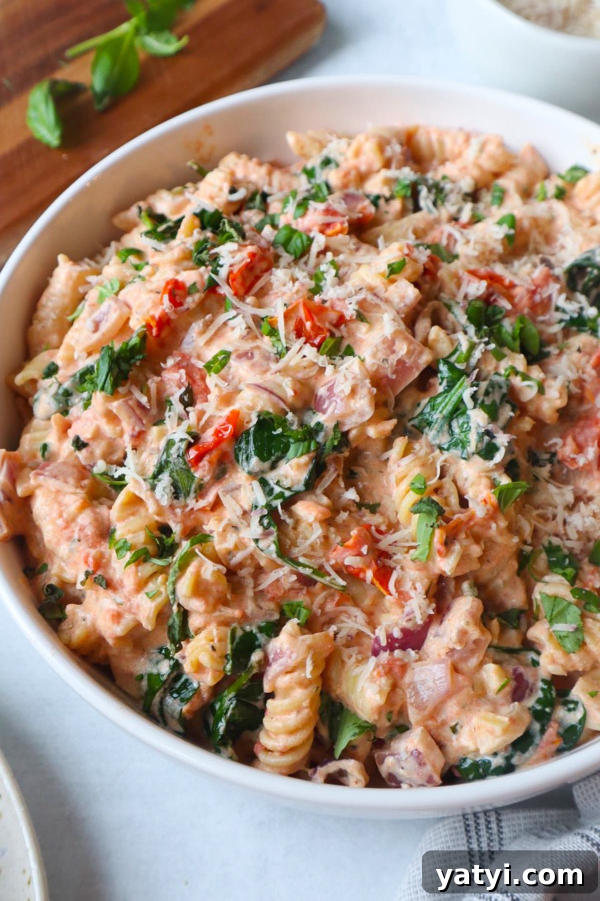 Creamy Boursin Tomato Pasta Bake — Viral TikTok Recipe 2 white bowl with boursin tomato pasta topped with parmesan cheese