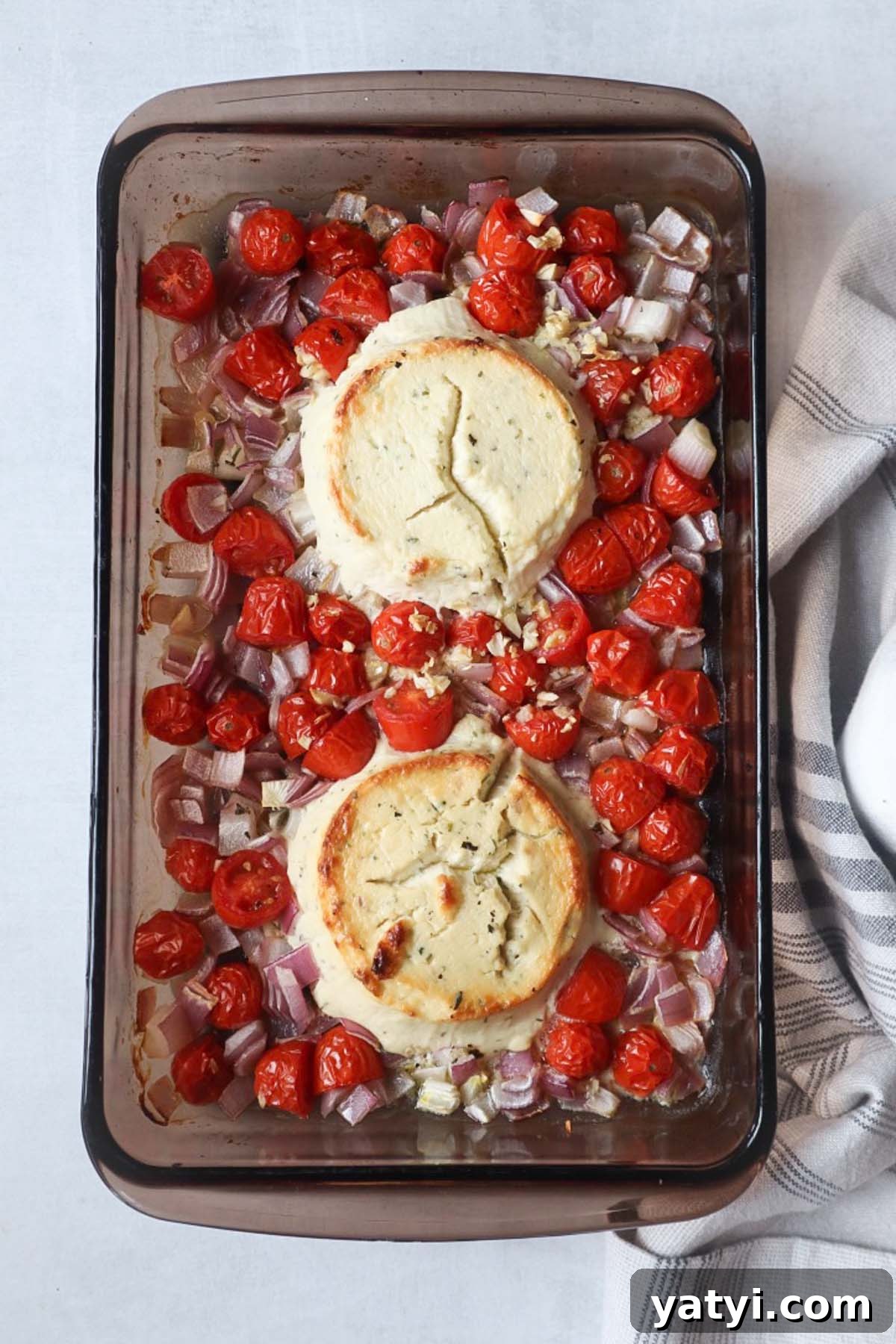 Creamy Boursin Tomato Pasta Bake — Viral TikTok Recipe 4 glass baking dish with roasted tomatoes, red onion, garlic, and two boursin pucks