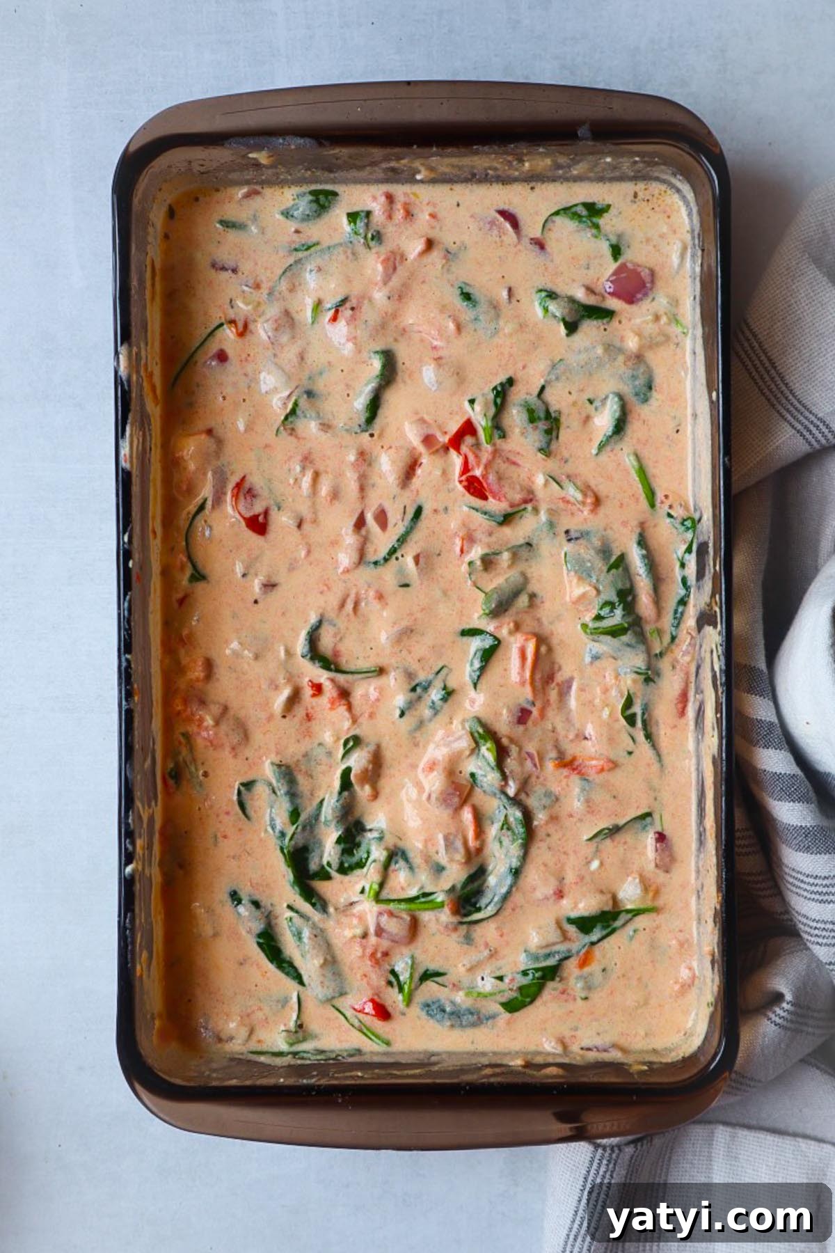 Creamy Boursin Tomato Pasta Bake — Viral TikTok Recipe 5 glass baking dish with boursin tomato sauce with spinach