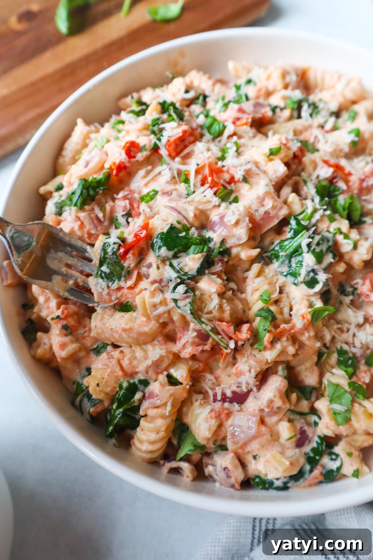 Creamy Boursin Tomato Pasta Bake — Viral TikTok Recipe 8 white bowl with boursin tomato pasta topped with parmesan cheese
