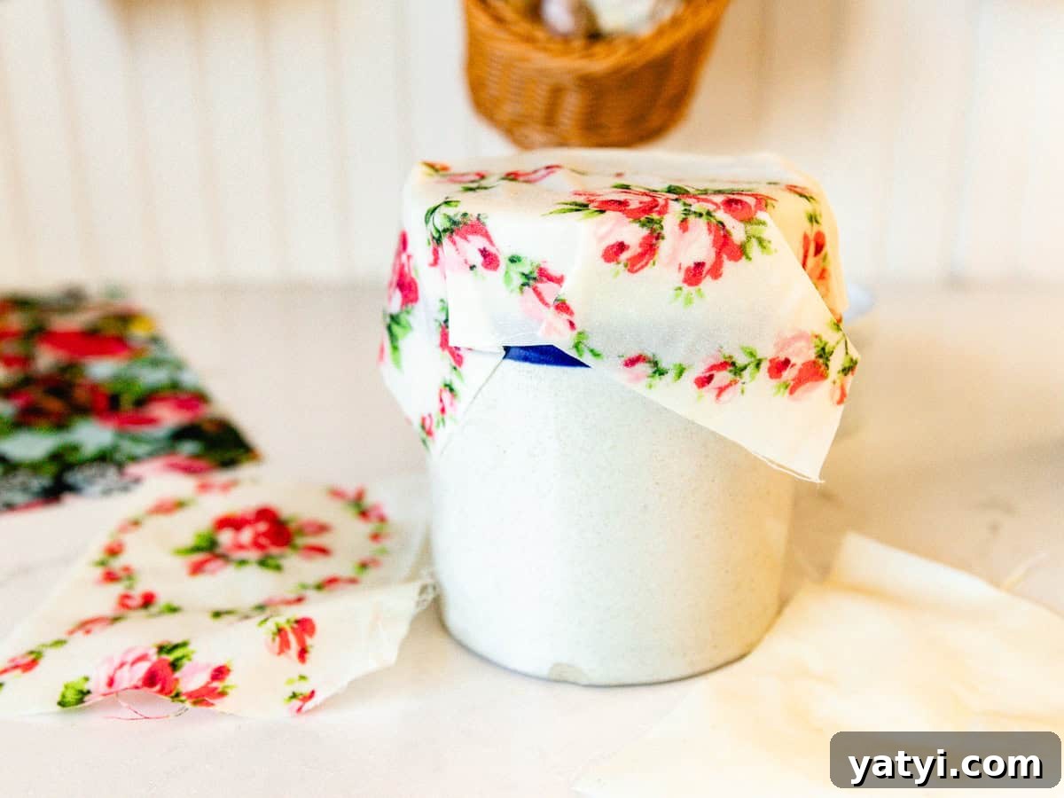 Make Beeswax Food Wraps at Home: Step-by-Step Guide 2 A homemade beeswax wrap covering a crock in a kitchen.
