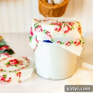 Make Beeswax Food Wraps at Home: Step-by-Step Guide 12 A homemade beeswax wrap covering a crock in a kitchen.