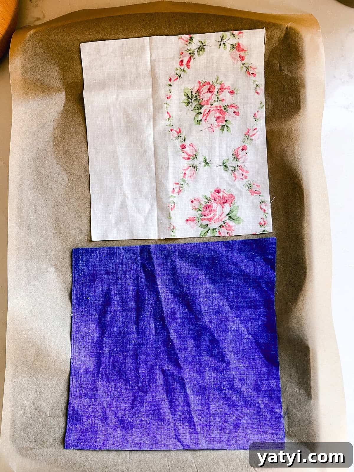 Make Beeswax Food Wraps at Home: Step-by-Step Guide 5 Laying fabric squares on a baking sheet lined with parchment paper.