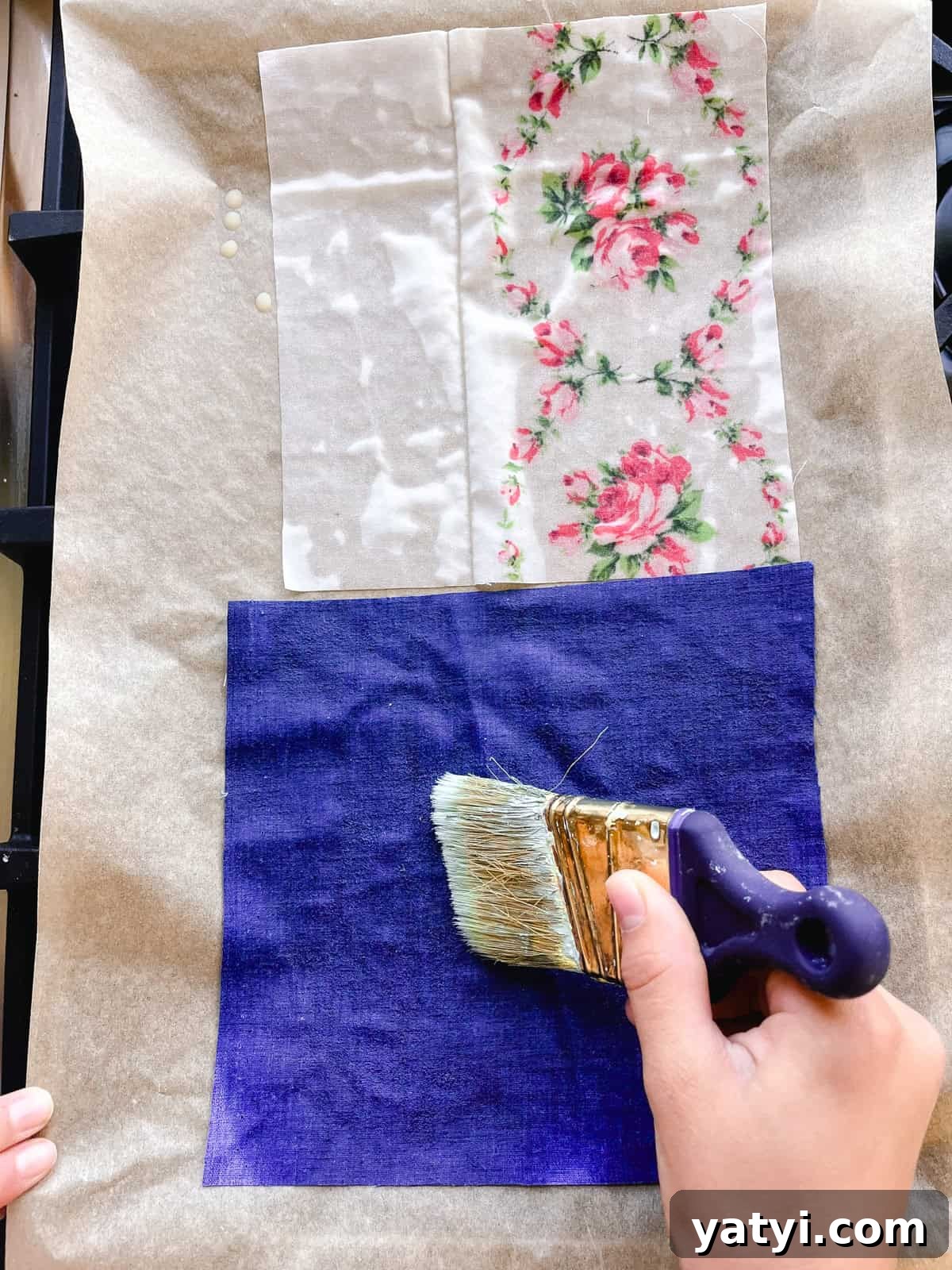Make Beeswax Food Wraps at Home: Step-by-Step Guide 7 Using a paintbrush to spread melted beeswax evenly over the fabric.