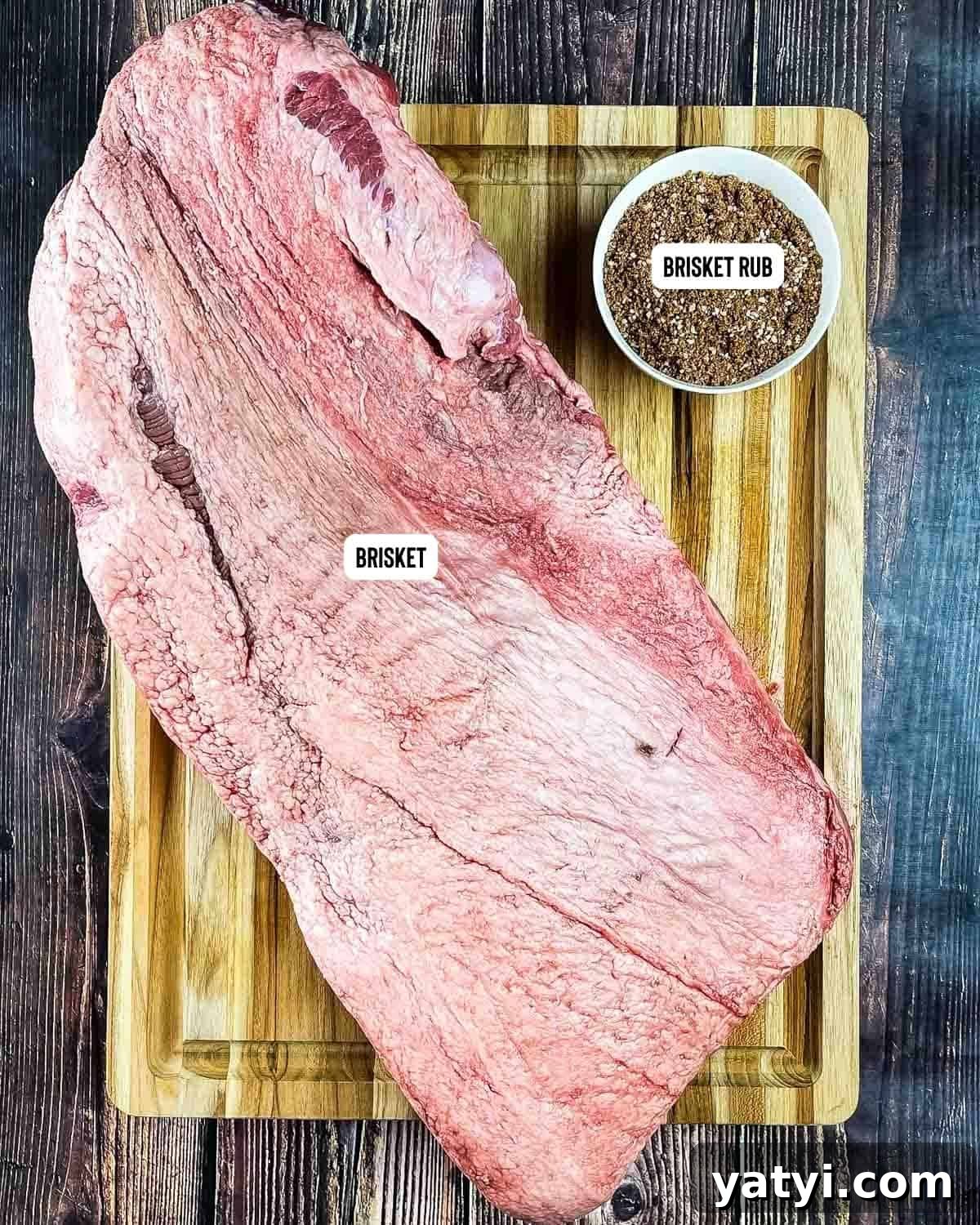 Ingredients for smoked brisket finished in oven on a wooden cutting board.