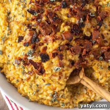Spoon dipped in sweet potato risotto.