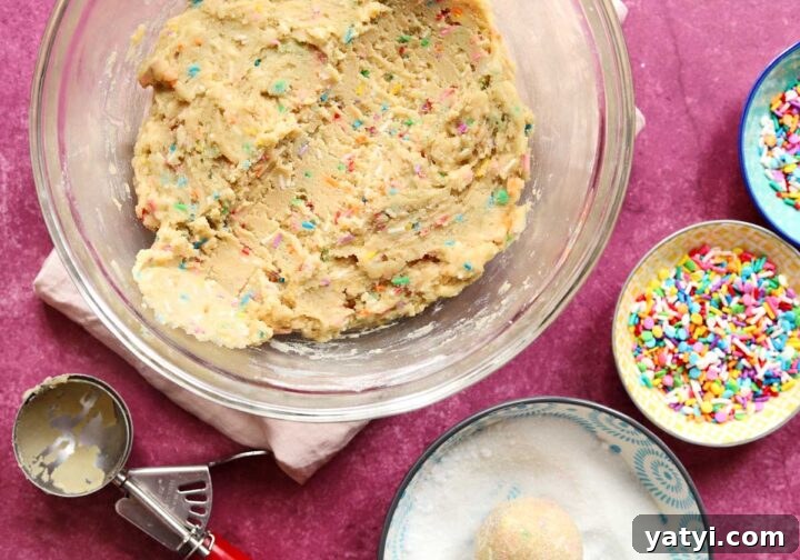 Soft Sprinkle Sugar Cookies Recipe for Perfectly Tender Cookies 4 sprinkle sugar cookie dough in bowl with scoop