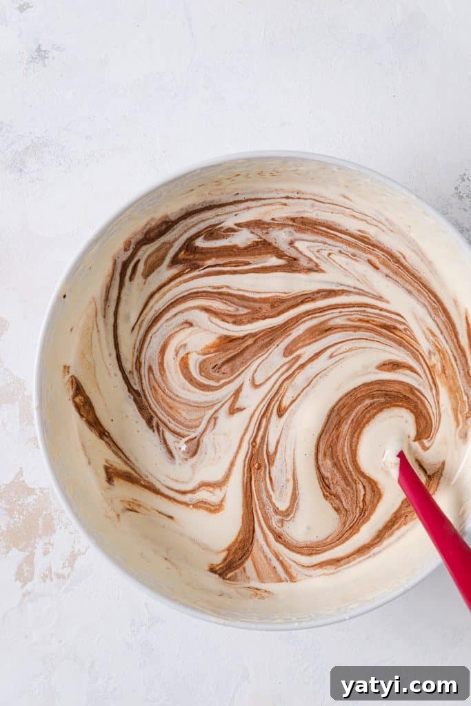 Decadent Chocolate Brownie Pudding Recipe for Chocolate Lovers 9 Adding melted chocolate to egg mixture