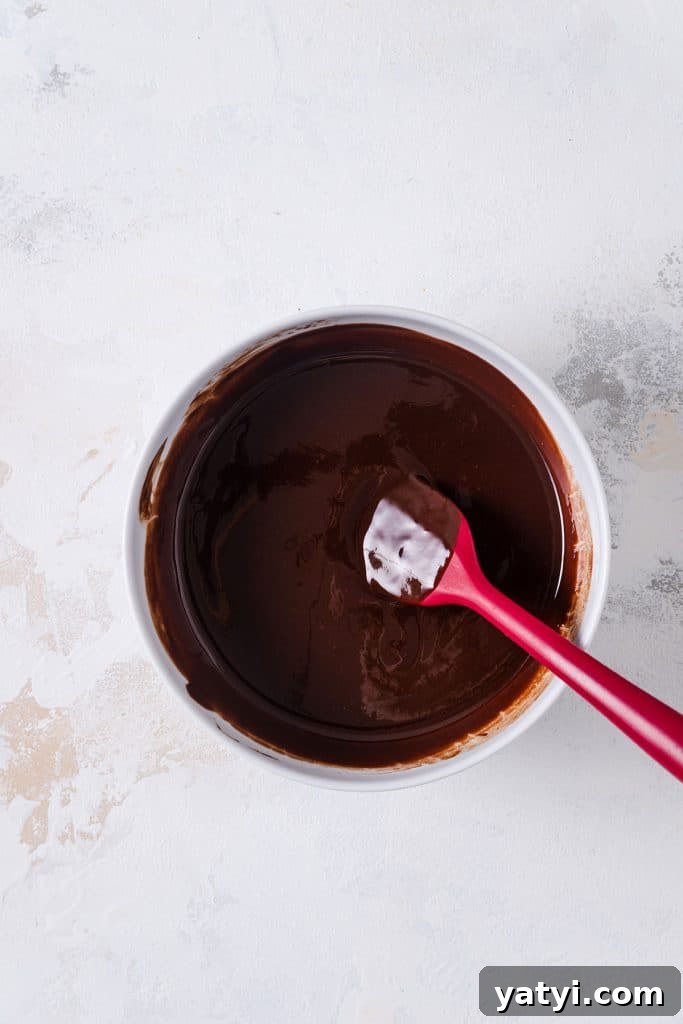 Decadent Chocolate Brownie Pudding Recipe for Chocolate Lovers 6 Melted butter and chocolate in a bowl.