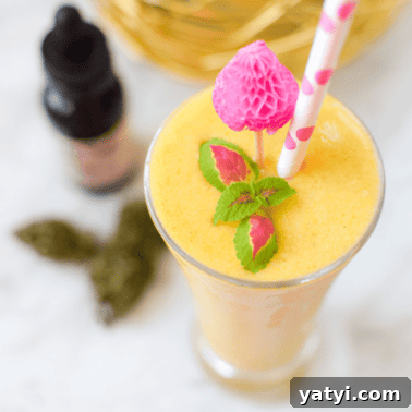 Do Mangoes Boost the Effects of Cannabis Edibles? 9 Tropical fruit and veggie cannabis smoothie in a glass.