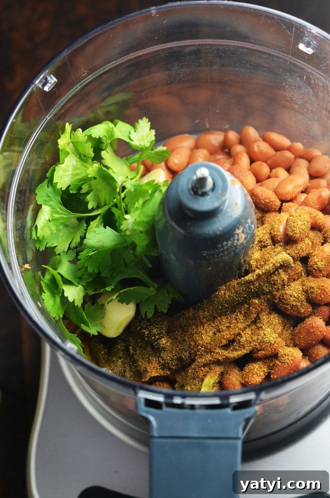 Jalapeño Pinto Bean Dip with Roasted Garlic and Lime 4 Jalapeno Pinto Bean "Hummus". This creamy dip is like a hybrid between spicy refried beans and hummus. Perfect for a party! | hostthetoast.com