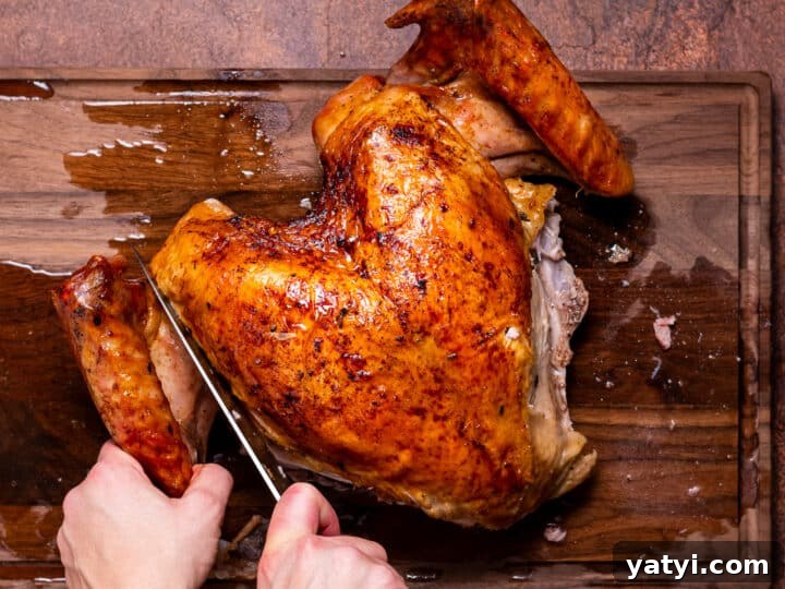 Dry-Brined Spatchcock Turkey: Complete Guide to Spatchcocking a Turkey 21 hands using a knife to remove turkey wings