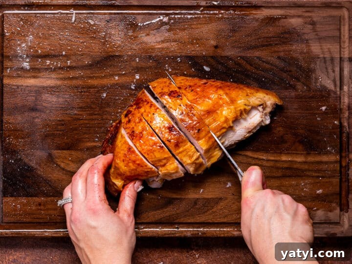 Dry-Brined Spatchcock Turkey: Complete Guide to Spatchcocking a Turkey 24 knife slicing breast with crispy skin into thick slices
