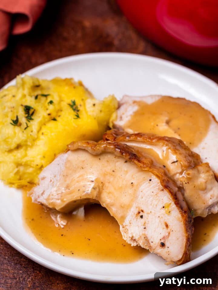 Dry-Brined Spatchcock Turkey: Complete Guide to Spatchcocking a Turkey 30 close up view of dry brined spatchcock turkey slice with silky smooth gravy