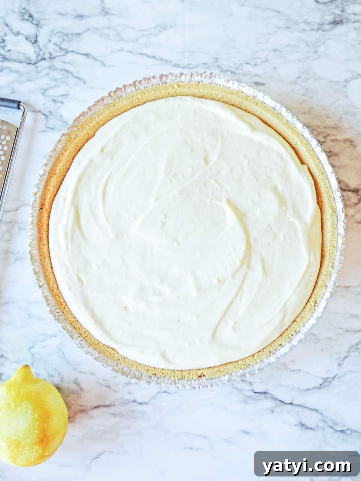 Zesty Lemon Pie with Graham Cracker Crust Recipe 5 pour lemon cheesecake mixture into graham cracker crust