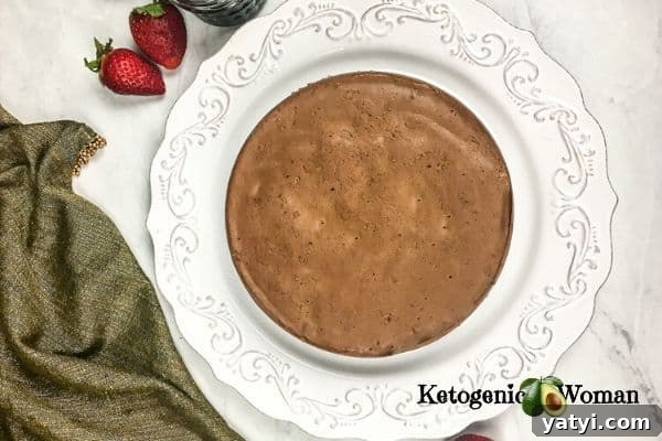 whole keto chocolate cheesecake on plate