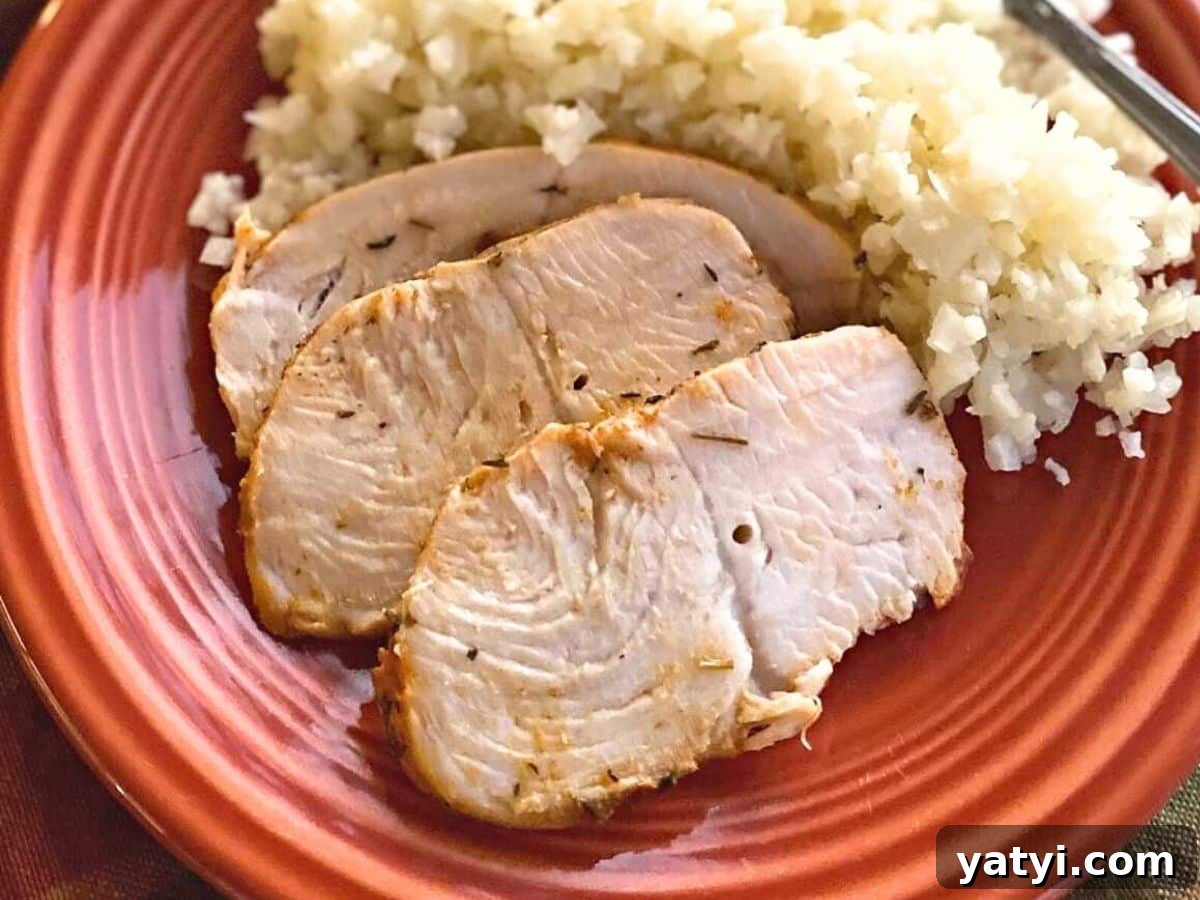 10 Quick Weeknight Dinners to Save Your Evenings 8 Three slices of oven-baked turkey tenderloin with cauli-rice on a rust plate.