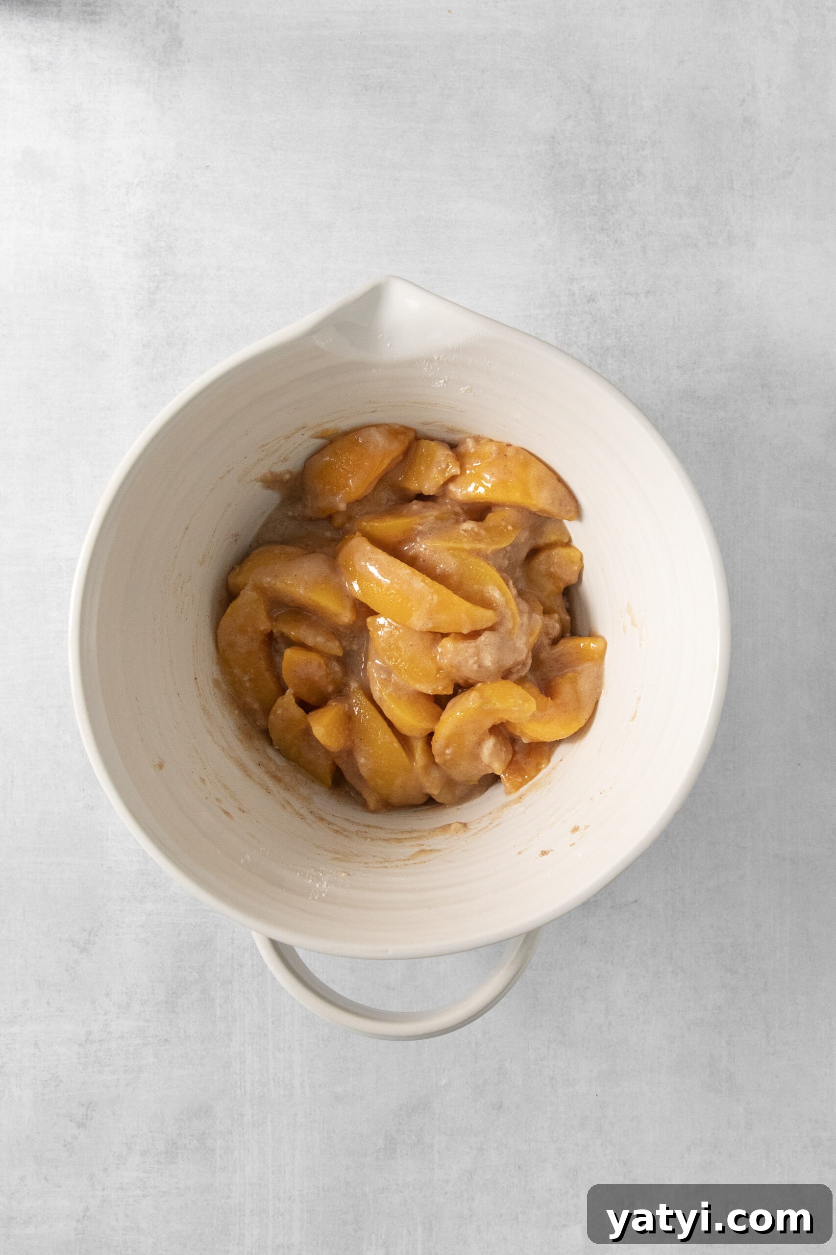 Classic Peach Pie Recipe Using Canned Peaches 8 peach filling and sugar in a mixing bowl