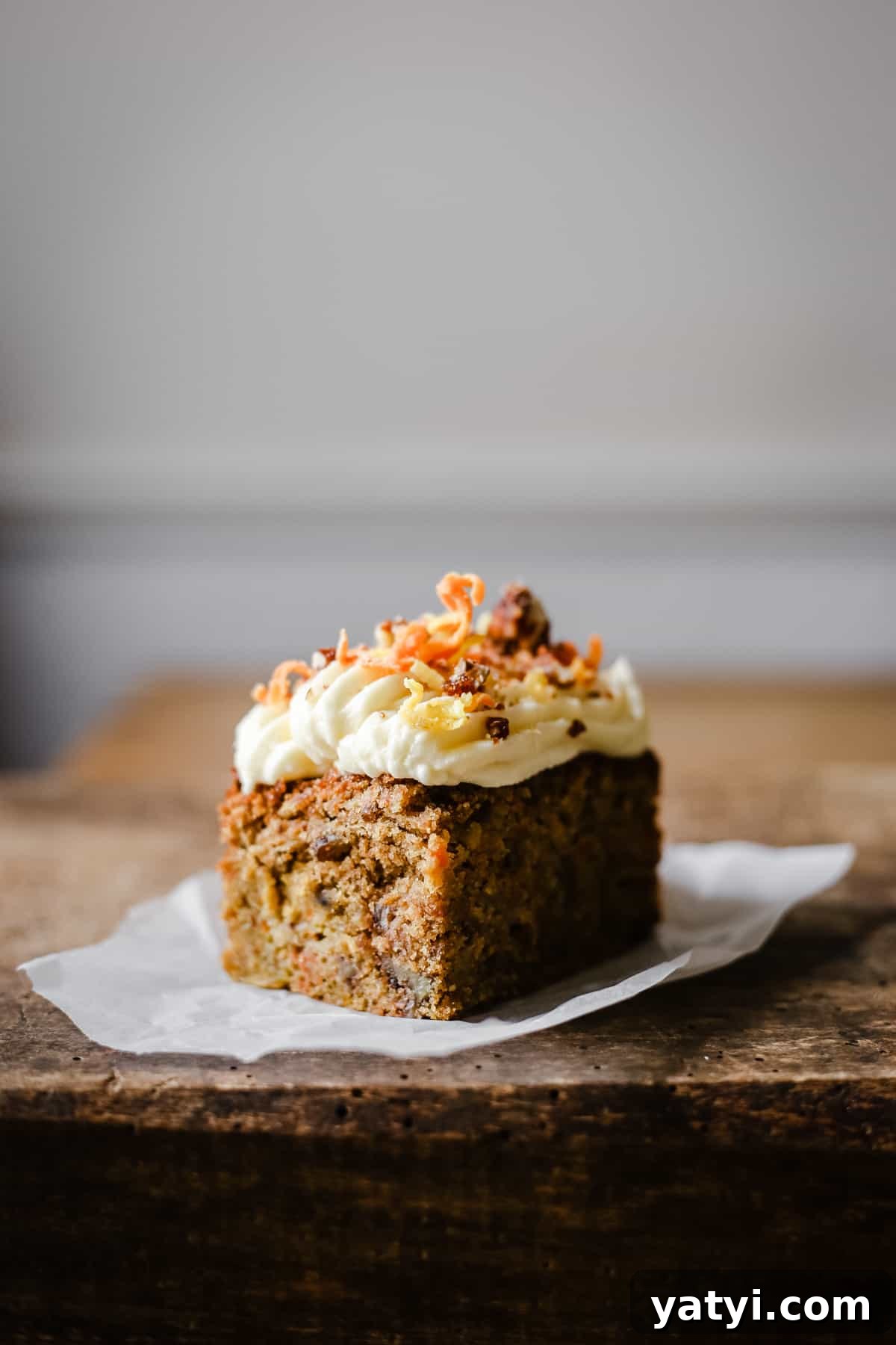 Gluten-Free Golden Beet and Carrot Cake Recipe 2 A piece of cake sitting on top of a wooden table