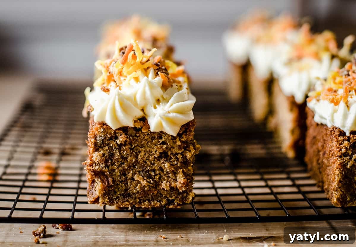 Gluten-Free Golden Beet and Carrot Cake Recipe 3 A close up of a pieces of cake sitting on a wire rack on top of a table