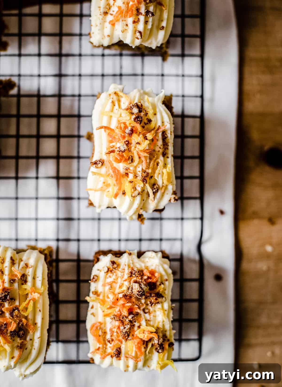 Gluten-Free Golden Beet and Carrot Cake Recipe 4 A close up of a pieces of cake sitting on a wire rack on top of a table