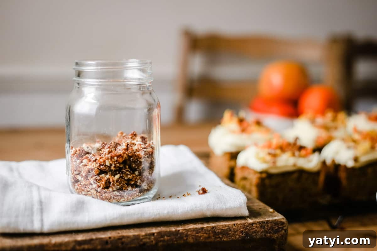 Gluten-Free Golden Beet and Carrot Cake Recipe 6 pecans in a jar next to slices of cake