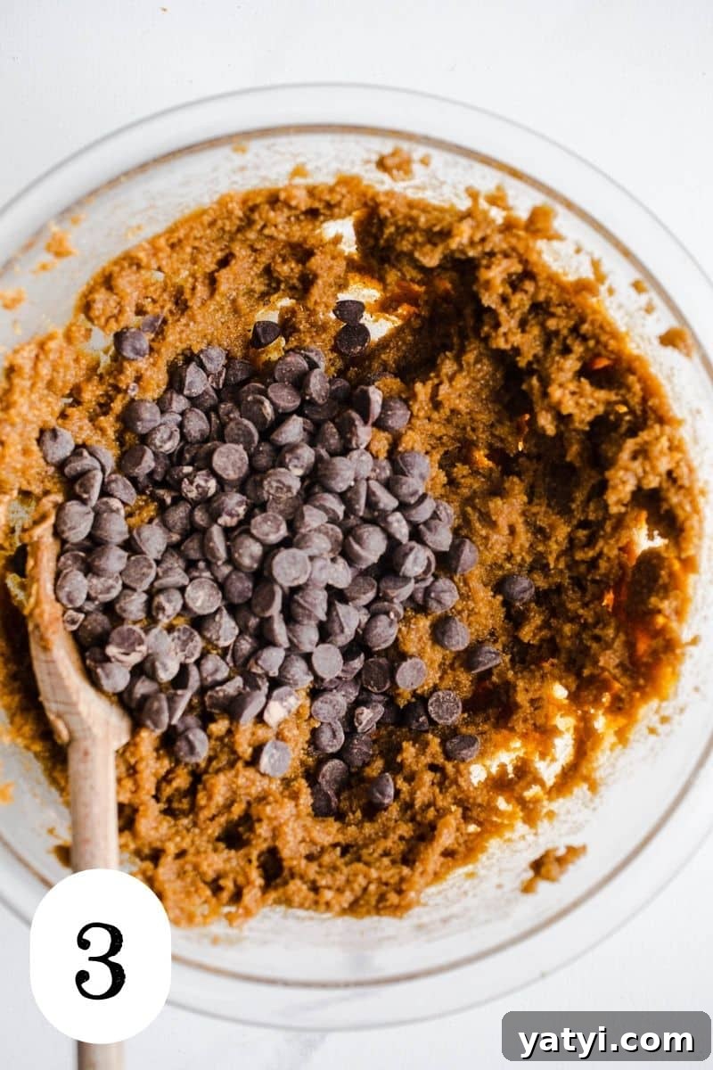 Gluten-Free Pumpkin Chocolate Chip Blondies You’ll Love 6 Chocolate chips in a bowl with blondie batter.