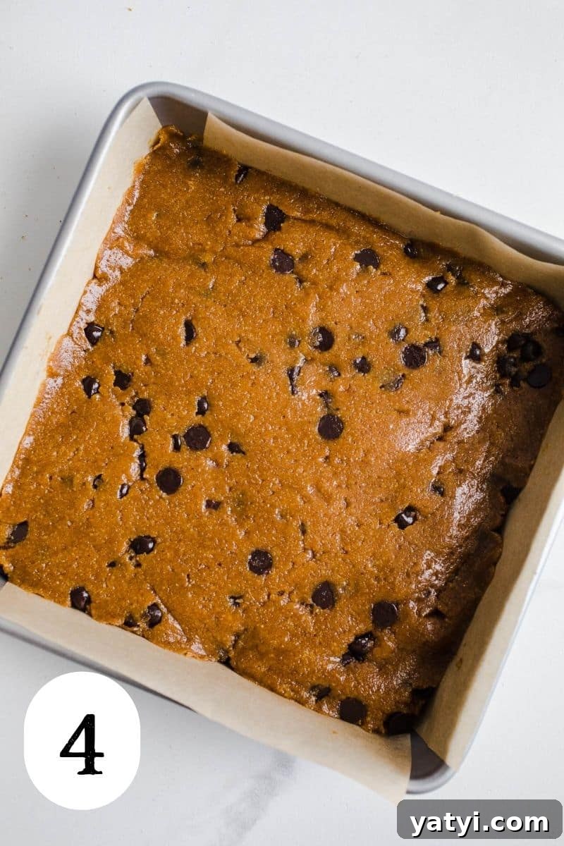 Gluten-Free Pumpkin Chocolate Chip Blondies You’ll Love 7 Blondie batter in a baking pan.