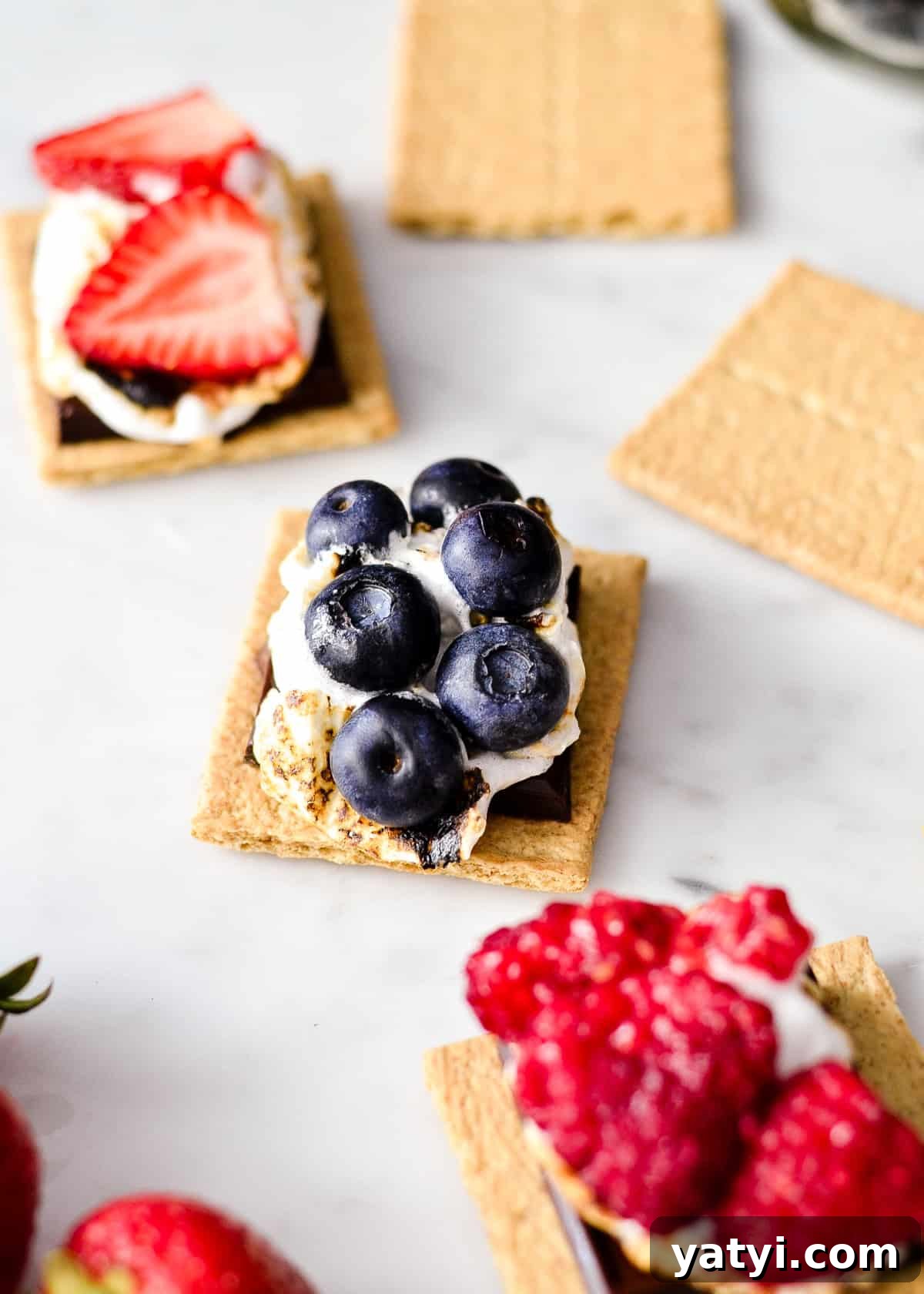 3 Berry S'mores being assembled - putting berries on the toasted marshmallow