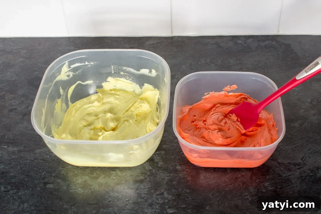 Bonfire Cupcakes Recipe: How to Make Campfire-Style Treats 10 Orange and yellow buttercream frosting in two separate plastic tubs.