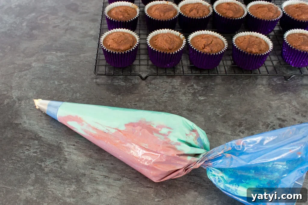 Bonfire Cupcakes Recipe: How to Make Campfire-Style Treats 11 Orange and yellow icing mixed together in the same piping bag.