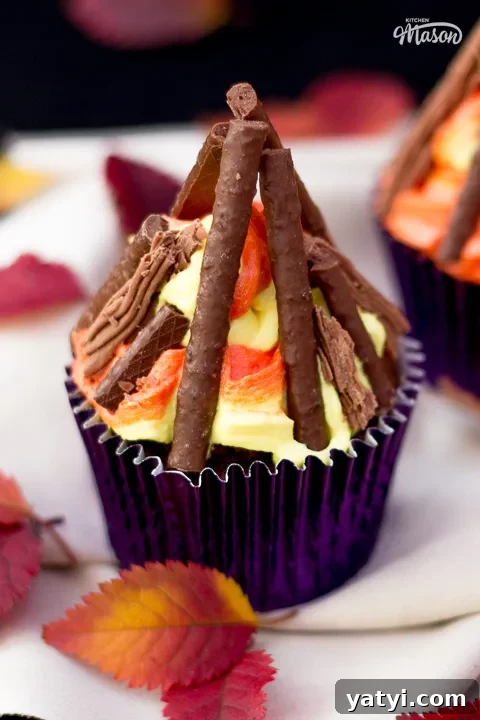 Bonfire Cupcakes Recipe: How to Make Campfire-Style Treats 3 A bonfire cupcakes with red and orange leaves scattered around it.