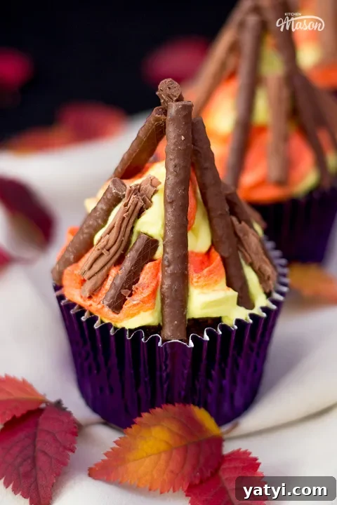Bonfire Cupcakes Recipe: How to Make Campfire-Style Treats 4 A bonfire cupcake in a dark purple cupcake case.