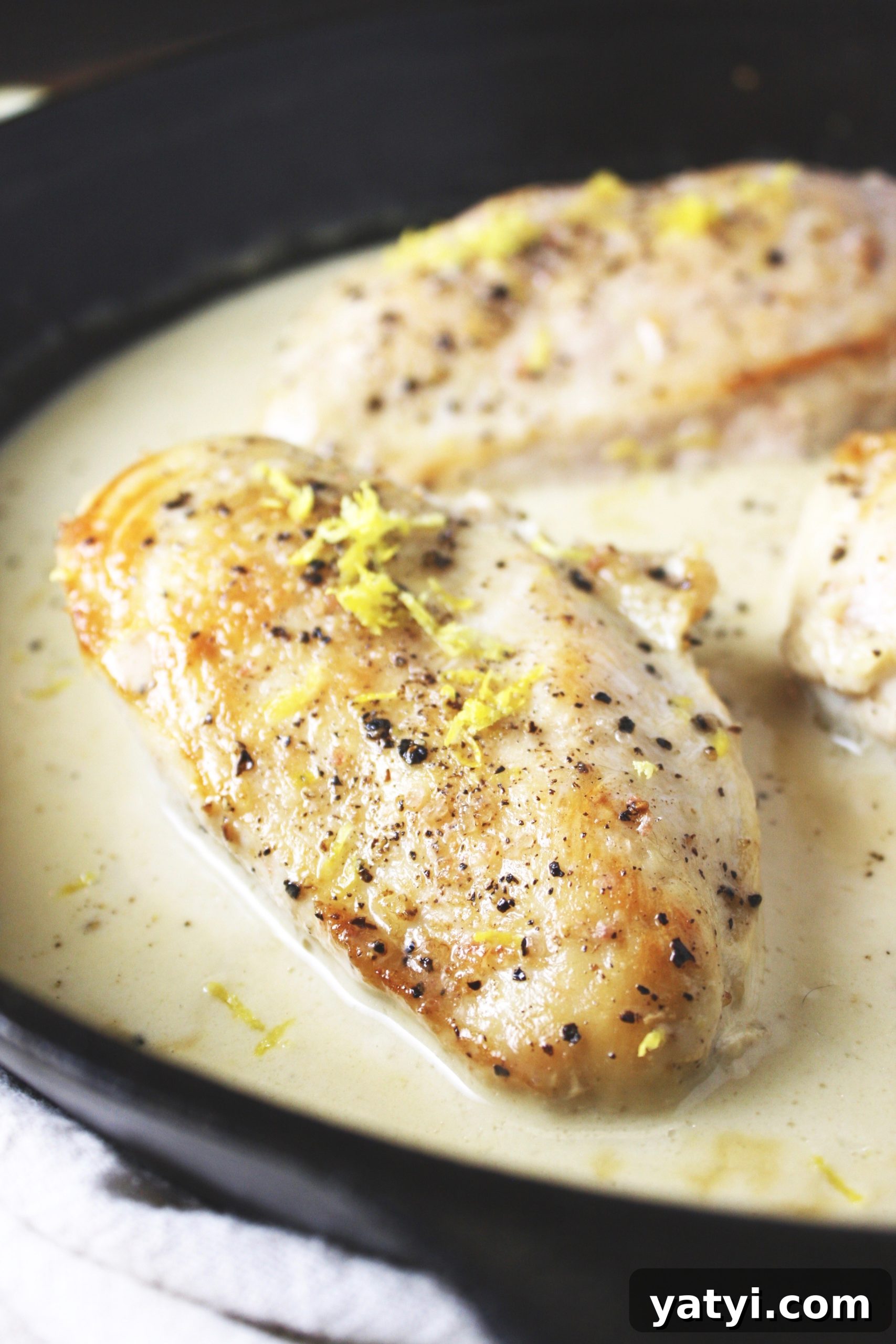 One Pan Lemon Coconut Chicken! This recipe takes literally 3 ingredients and 20 minutes to make! It couldn’t get any easier than this, and the flavor is outstanding! I love serving this over rice. TheGarlicDiaries.com  