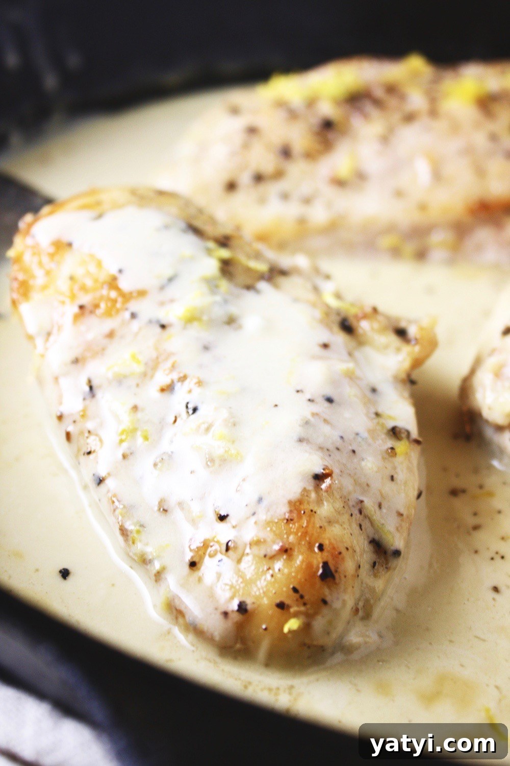One Pan Lemon Coconut Chicken! This recipe takes literally 3 ingredients and 20 minutes to make! It couldn’t get any easier than this, and the flavor is outstanding! I love serving this over rice. TheGarlicDiaries.com