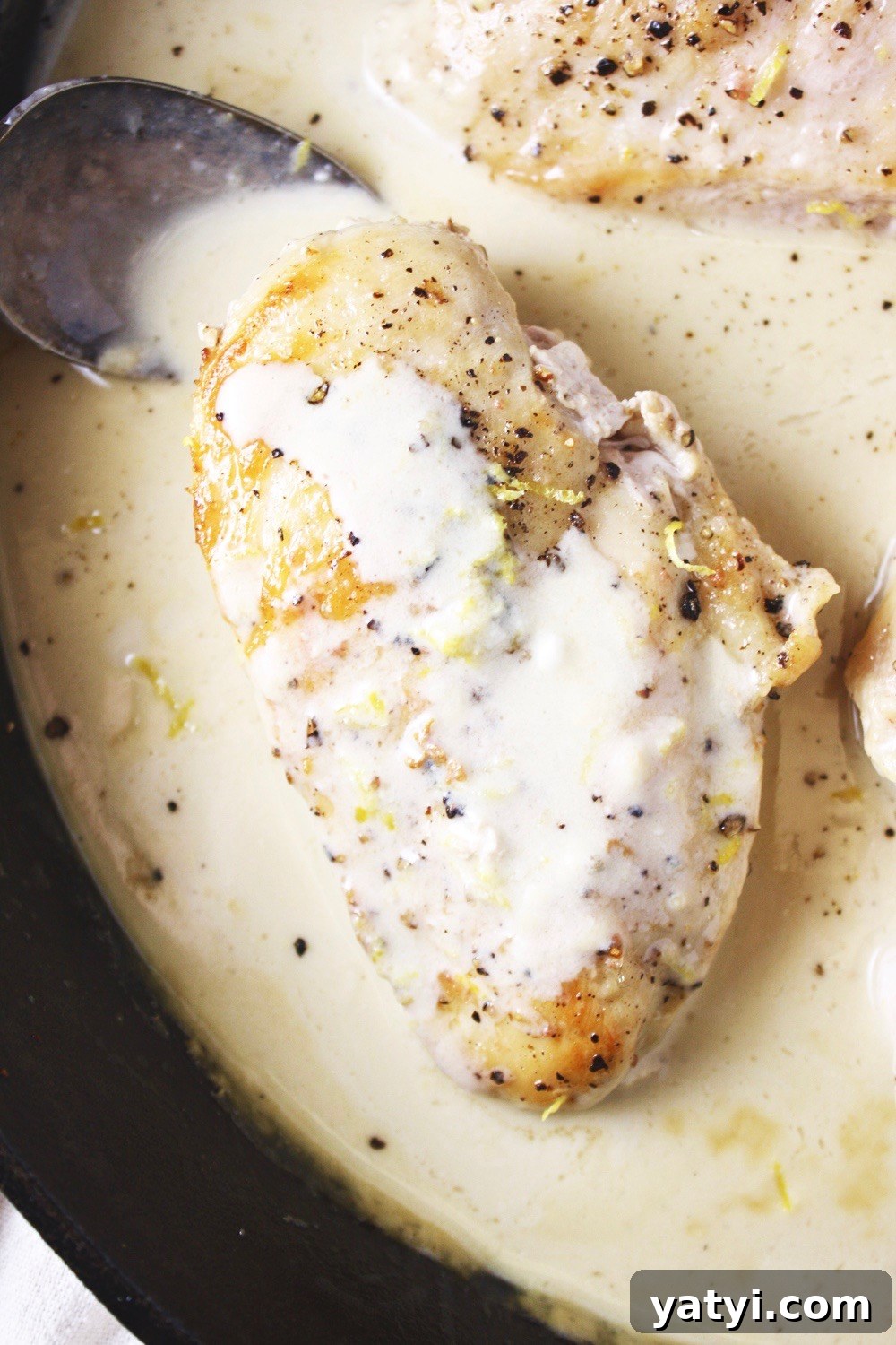 One Pan Lemon Coconut Chicken! This recipe takes literally 3 ingredients and 20 minutes to make! It couldn’t get any easier than this, and the flavor is outstanding! I love serving this over rice. TheGarlicDiaries.com