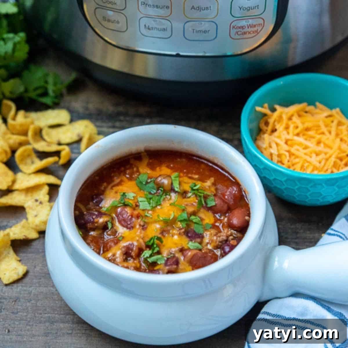 Chili For Everyone Bowl of chili next to instant pot.
