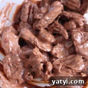 How to Make Chocolate-Covered Pecans at Home 11 Butter Roasted Pecans mixed with melted chocolate and coconut oil.