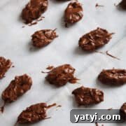 How to Make Chocolate-Covered Pecans at Home 12 Chocolate covered pecans on parchment paper to harden.
