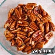 How to Make Chocolate-Covered Pecans at Home 9 Melted butter and pecans mixed together.