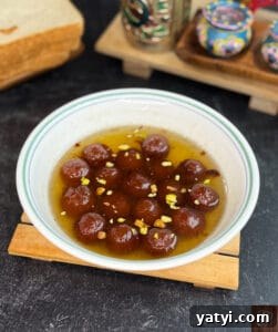Instant Bread Gulab Jamun Recipe — Soft, No-Yeast Indian Dessert 3 Delicious bread gulab jamun soaked in sweet syrup with nuts, perfect for festive occasions.