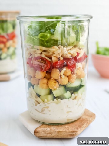 A layered salad in a mason jar.