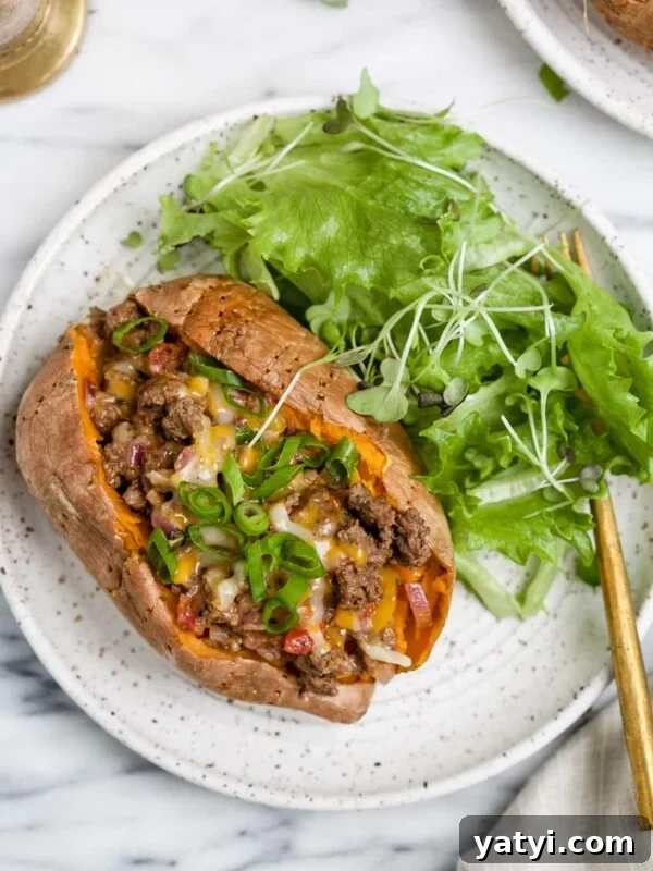 Crispy Air Fryer Sweet Potatoes: Quick Roast in 20 Minutes 12 overhead view of stuffed sweet potato on a white plate